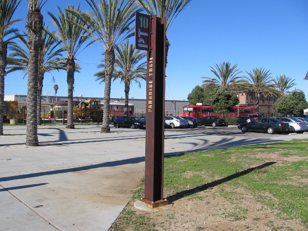 Paradise Trail marker PT10 rises near the National City Depot museum.