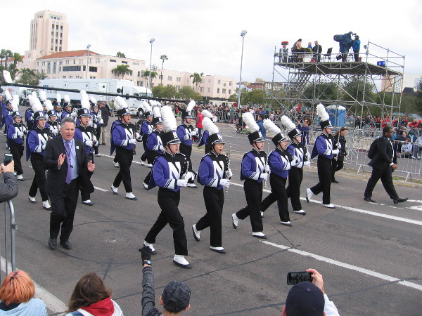 Members of the Northwestern University Wildcat Marching Band thunder past!