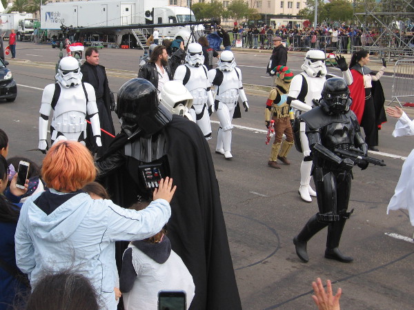 Darth Vader says hello to someone watching the cool parade.