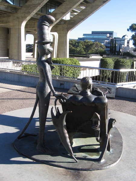 A bronze Cat in the Hat stands at the shoulder of Dr. Seuss.