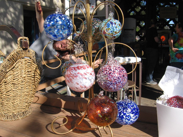 I was taking a photo of glass Christmas ornaments in Spanish Village when I got photobombed!