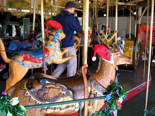 Some of the carved wooden animals of the Balboa Park Carousel were wearing elf and Santa hats.