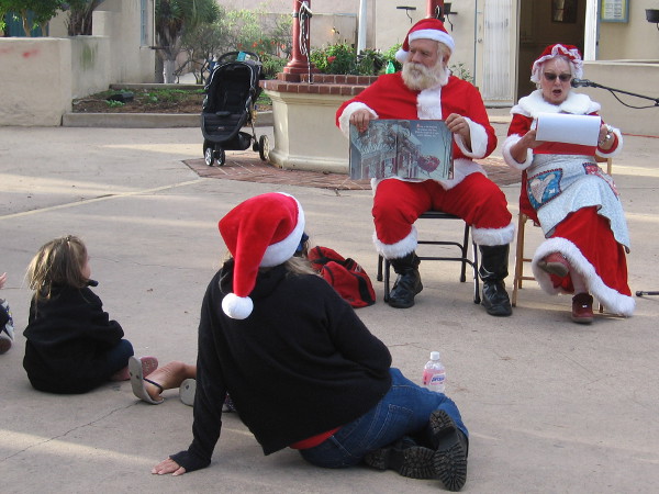 A bit later, Santa and Mrs. Claus read The Night Before Christmas to gathered children and the young-at-heart.