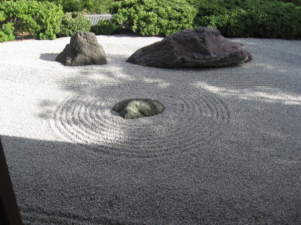Windows at the Japanese Friendship Garden look out at the Karesansui Dry Stone Garden, where magic gradually appears for those who are still.