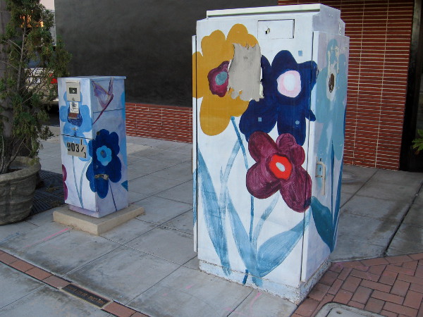 The ceremonial Book Pass from the old branch library to the new branch library will head east along the West Washington Street sidewalk past these flowers.