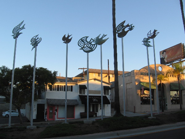 Those who take part in the symbolic opening ceremony, as they approach the new branch library, will carry books past this flock of birds!