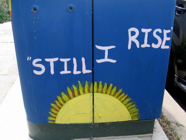 Inspiring street art reveals the sun's bright message . . . Still I rise.