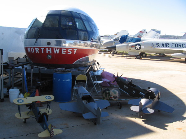 Outside the hangar doors is the nose of an old Northwest Stratocruiser that once flew to Honolulu.