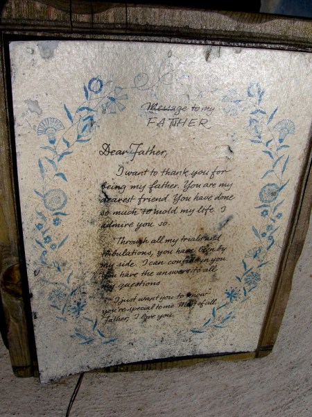 A simple, emotionally powerful letter at the base of the flagpole. ...Most of all, Father, I love you.