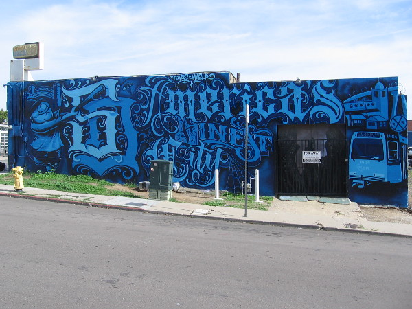 A mural on another side of the same building pays tribute to America's Finest City. By street artists Dyse One and Haslr.