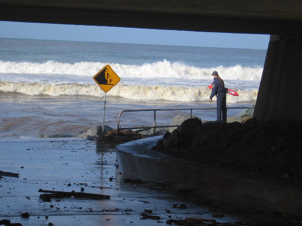 A lifeguard keeps an eye on wild surf at Torrey Pines State Beach.