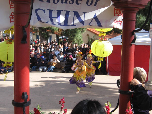 Colorful young dancers on stage celebrate the Chinese New Year in San Diego.