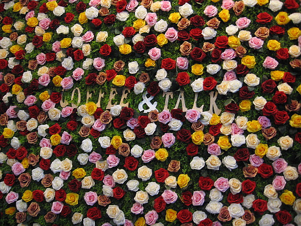 A wall of roses welcomes guests to Coffee 'N' Talk.