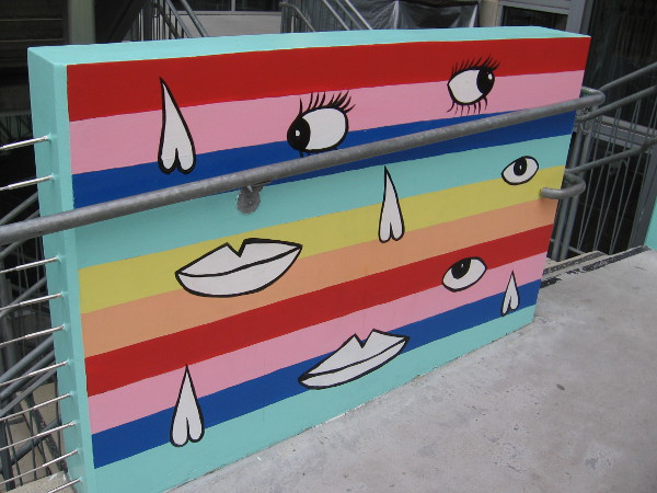 Section of SMILE, by artist PANCA. The fun 48-foot-long mural decorates the bridge leading to the entrance of The New Children's Museum.