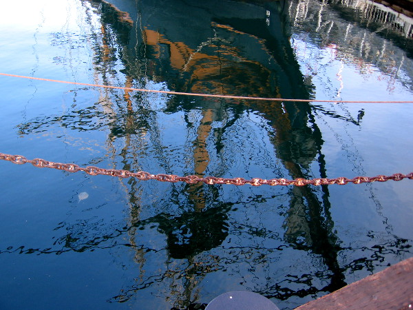Reflection on the water of HMS Surprise.
