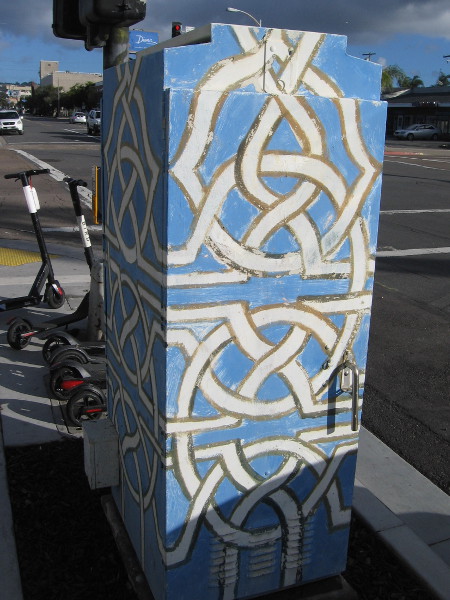 Interwoven geometric design on an electrical box.