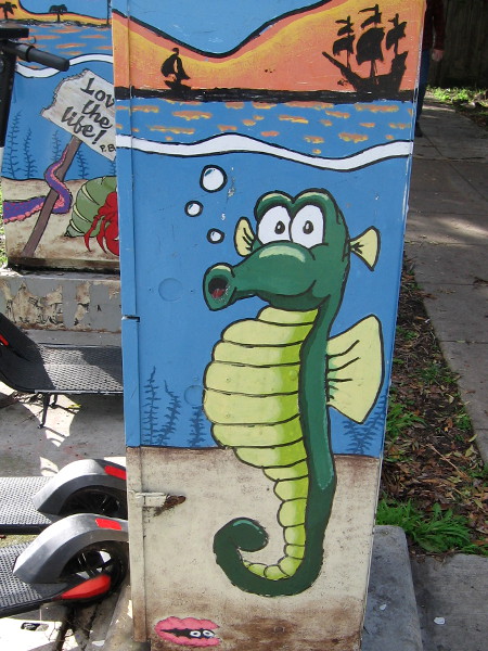 A funny green seahorse and pink clam.