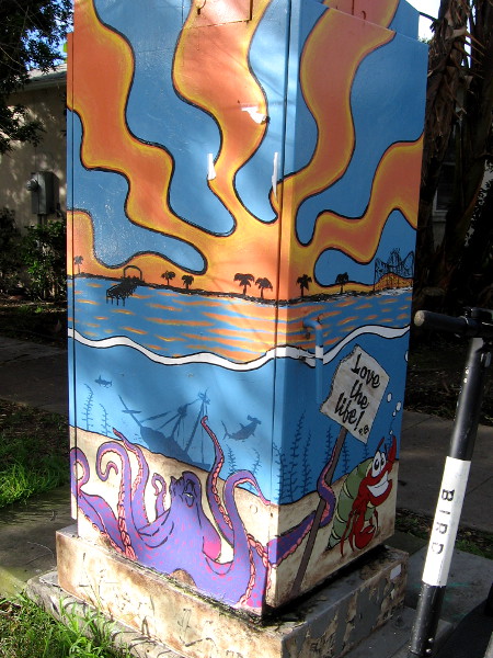 Fun street art on two sides of one box.