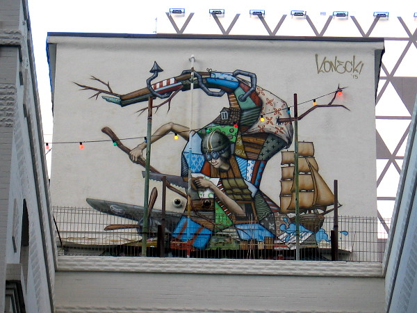 It's a cool mural! It appears to have been painted in 2015 by Christopher Konecki.