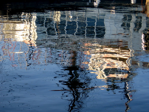 Reflection on the water of HMS Surprise and Steam Ferry Berkeley.