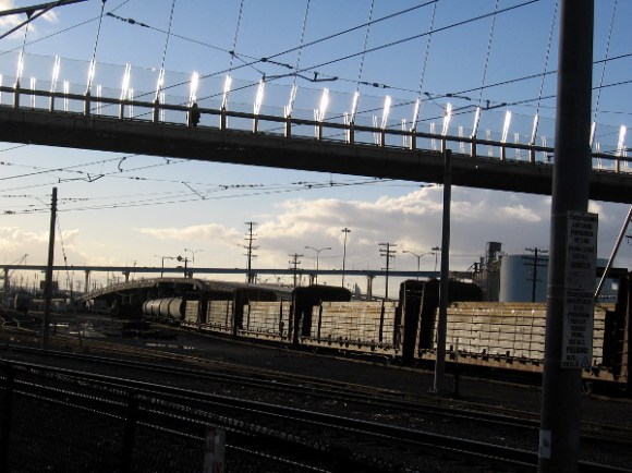 Gleaming light on bridge and train.