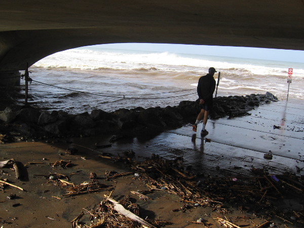 Mud and debris under the bridge. The result of a strong winter storm and the mighty ocean.