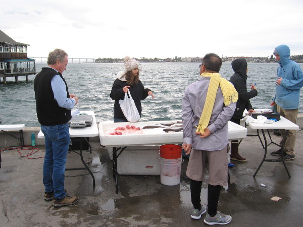 What's a little wind and chilly weather when there's freshly caught fish waiting!