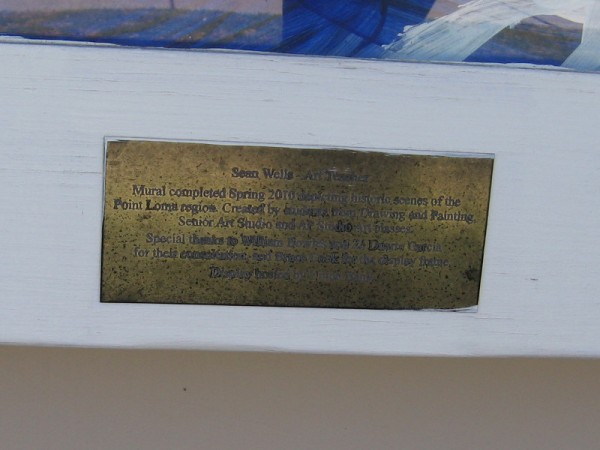 Plaque describes the artwork. Sean Wells - Art Teacher. Mural completed Spring 2010 depicting historic scenes of the Point Loma region.