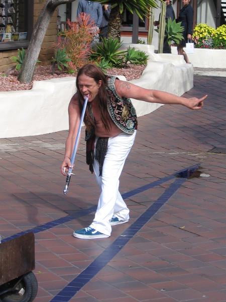 That's a genuine, long and very sharp sword poised on Murrugun's tongue.