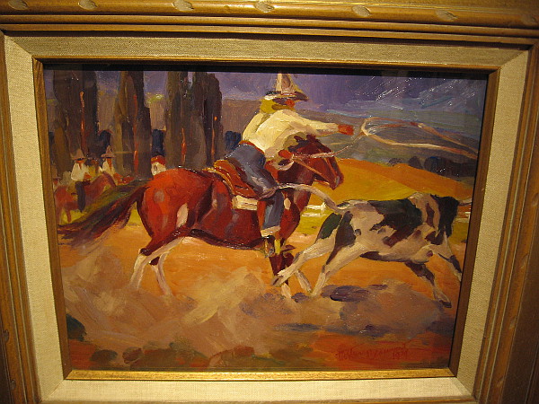 Cowboy at the Corral Lassoing a Steer, oil, 1929. The Bowers Museum.