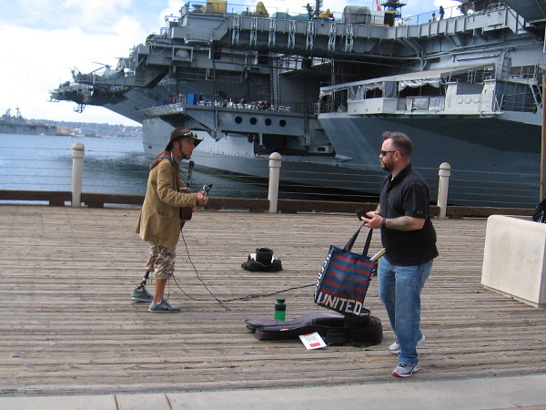 Cool guy Gary Reid provides soulful music by the USS Midway.