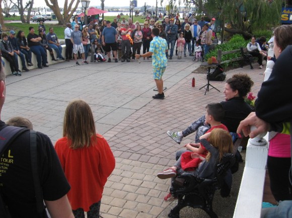 Today is the second day of Seaport Village's annual busker festival. George Gilbert from Fort Myers Beach, Florida entertains a good crowd.