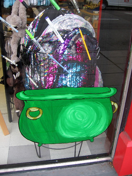 Glittery merchandise like a pot of gold in the window of Blick Art Materials.