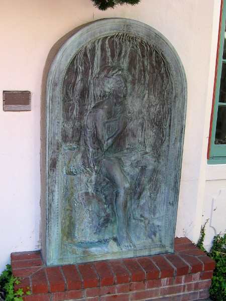 Bronze artwork near the Athenaeum's rotunda. Young Girl Holding Book by Merrell Gage, 1925.
