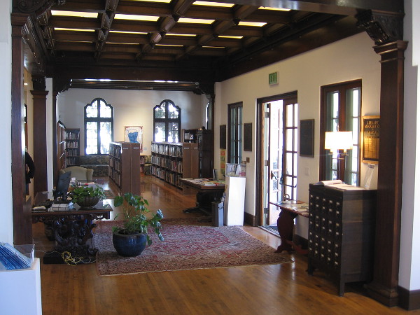 Inside the beautiful, welcoming Athenaeum. Gazing east at shelves and windows.