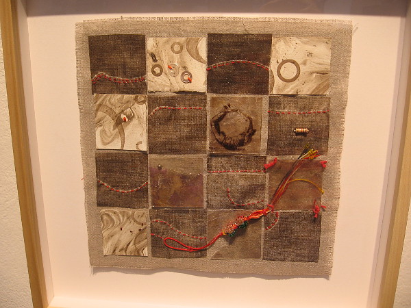 Oh Grid, 2019, Sibyl Rubottom. Etching on linen with sashiko. One of many textile pieces by the artist currently on exhibit in the Rotunda Gallery.