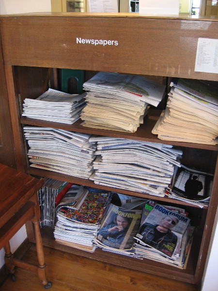 Shelves with newspapers and magazines.