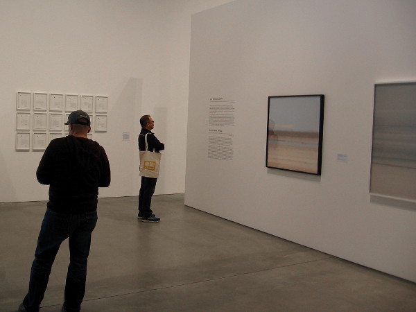Visitors to the downtown Museum of Contemporary Art San Diego enjoy photographs and other pieces by Trevor Paglen.