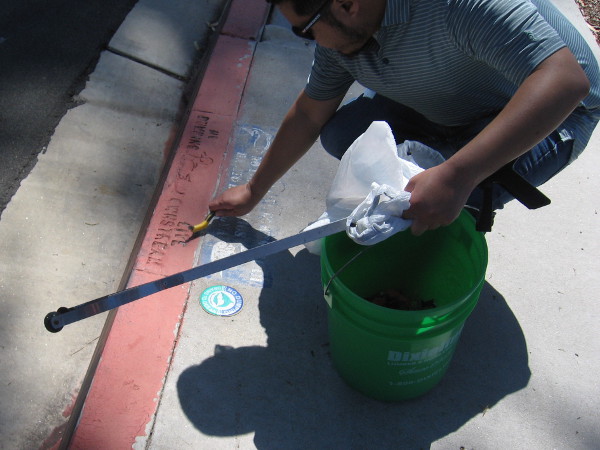 At work on a Liberty Station sidewalk.