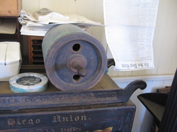 To proof newspaper sheets as type was assembled, this huge heavy roll would be used to make a quick impression.