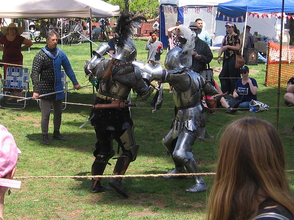 Knights in shining armor mock battle in Balboa Park during the House of England lawn program!