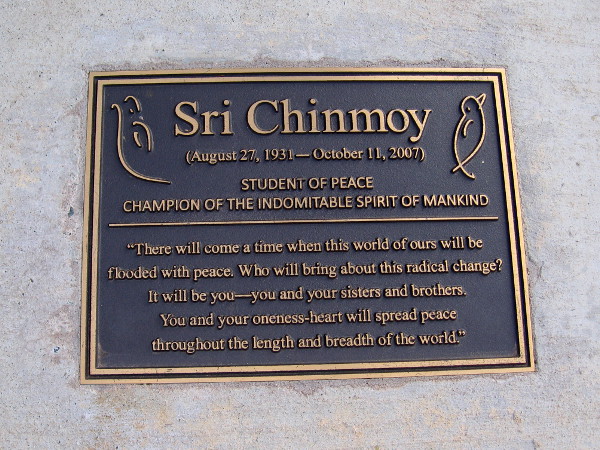 Plaque in a small park dedicated to Sri Chinmoy. STUDENT OF PEACE--CHAMPION OF THE INDOMITABLE SPIRIT OF MANKIND