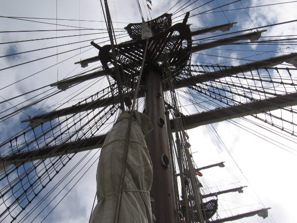 Tilting my head upward to gaze at the tall ship's masts, yards and rigging.