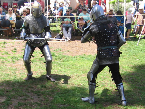 Knights entertain an outdoor audience at the House of England's lawn program in Balboa Park.