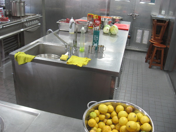 A photo through a window into the ship's kitchen, where Peruvian dishes are prepared for the crew and foreign guests.