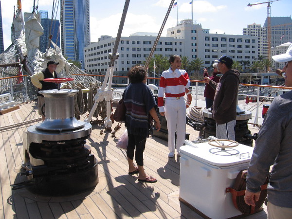 Visitors learn a bit about the tall ship's operation, including how an anchor is lowered.