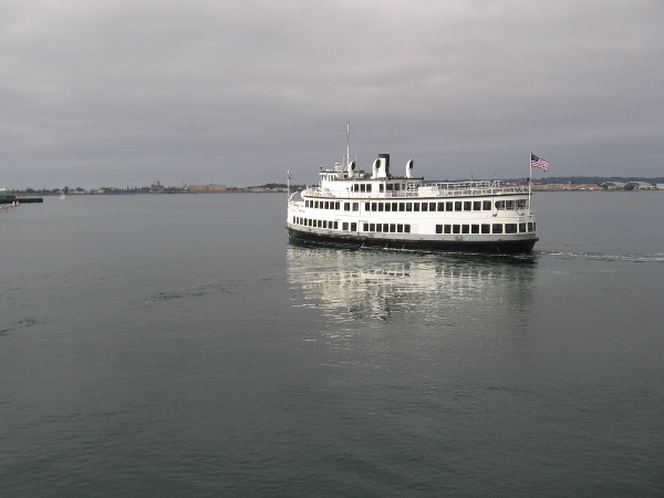 Sunshine breaking through the morning clouds turns the Admiral Hornblower bright white.