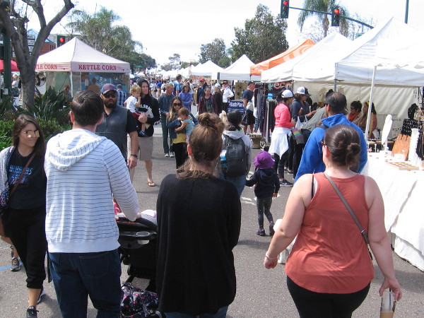 People fill several blocks of scenic Highway 101 and enjoy a fine April weekend at the Encinitas Spring Street Fair.
