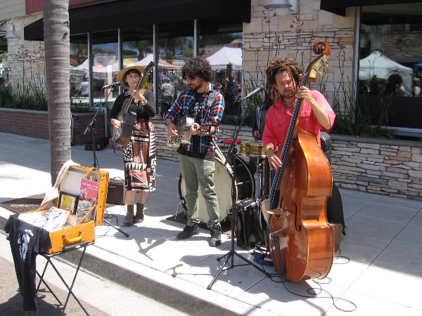 The band Nathan & Jessie provide some sidewalk entertainment. Check out nathanandjessie.com