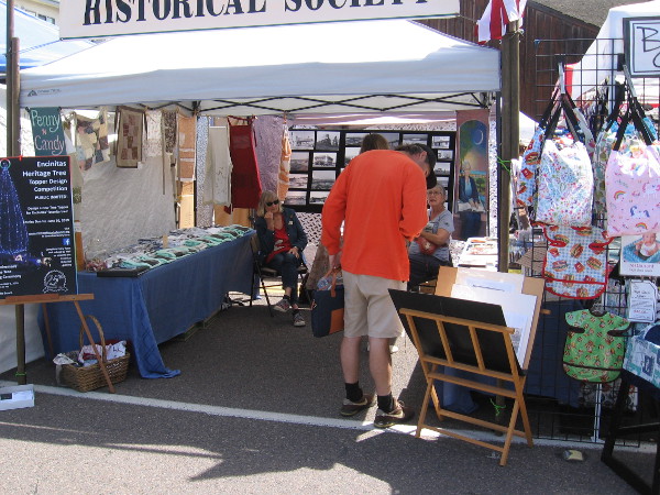 Someone investigates displays at the Encinitas Historical Society tent.